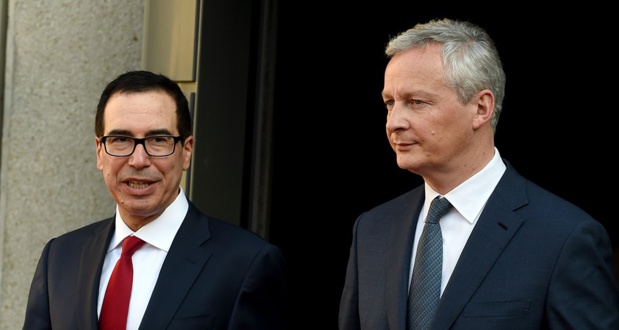 Le secrétaire au Trésor Steven Mnuchin (à gauche) est opposé à une taxation des géants du numérique au niveau national, comme la France l'envisage. Le ministre de l'Economie Bruno Le Maire (à droite) a rappelé mardi que la France « est un Etat libre et souverain qui décide de sa taxation ». - AFP