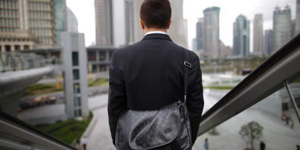 Les employés de bureau et les cadres chinois font souvent plus de huit heures supplémentaires par jour, en dépit du droit du travail. | REUTERS Les employés de bureau et les cadres chinois font souvent plus de huit heures supplémentaires par jour, en dépit du droit du travail. | REUTERS